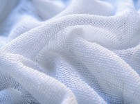 white-blanket-with-white-border-that-says-tp-it.jpg